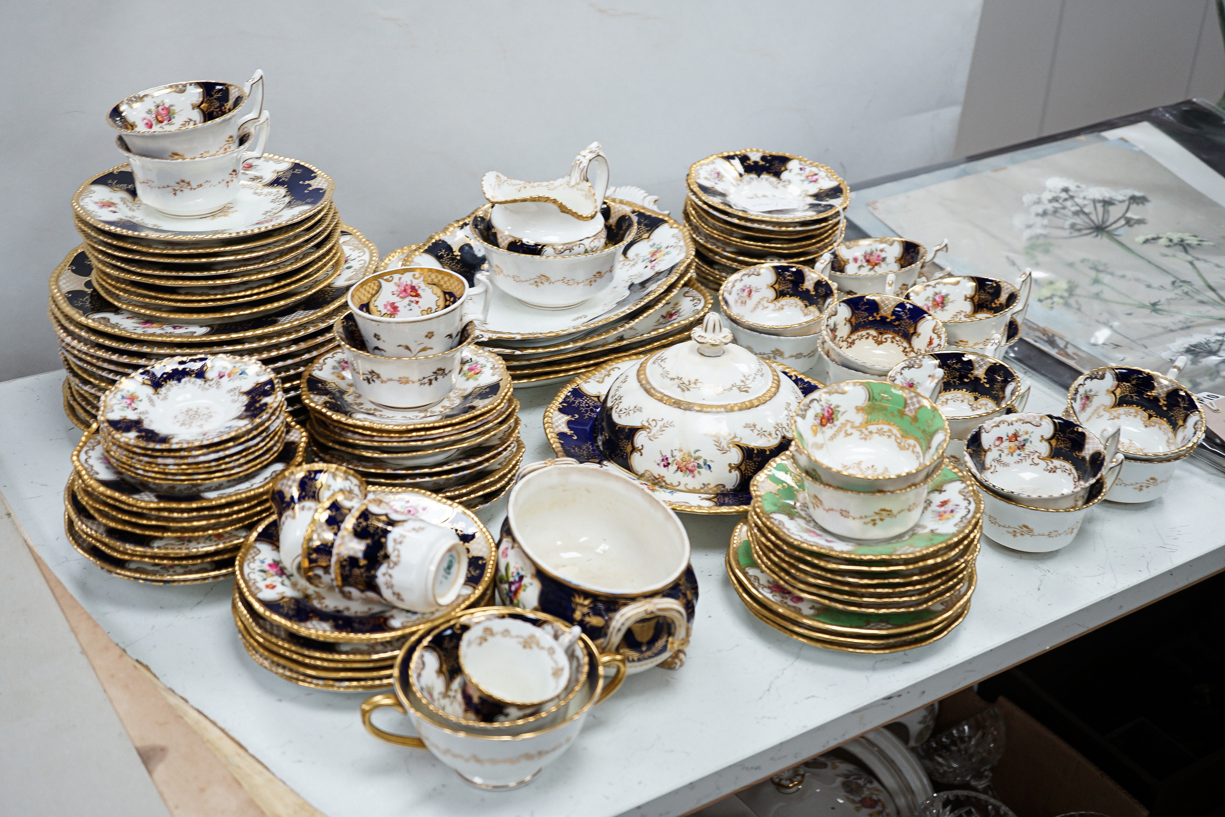 A large set of Coalport blue ground tea and coffee service and similar green ground tea wares